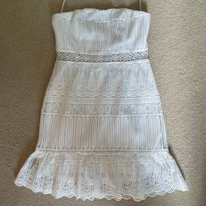 White lace strapless dress with ruffle detail